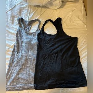 2 lululemon swiftly tech tanks ( black and grey size 6)